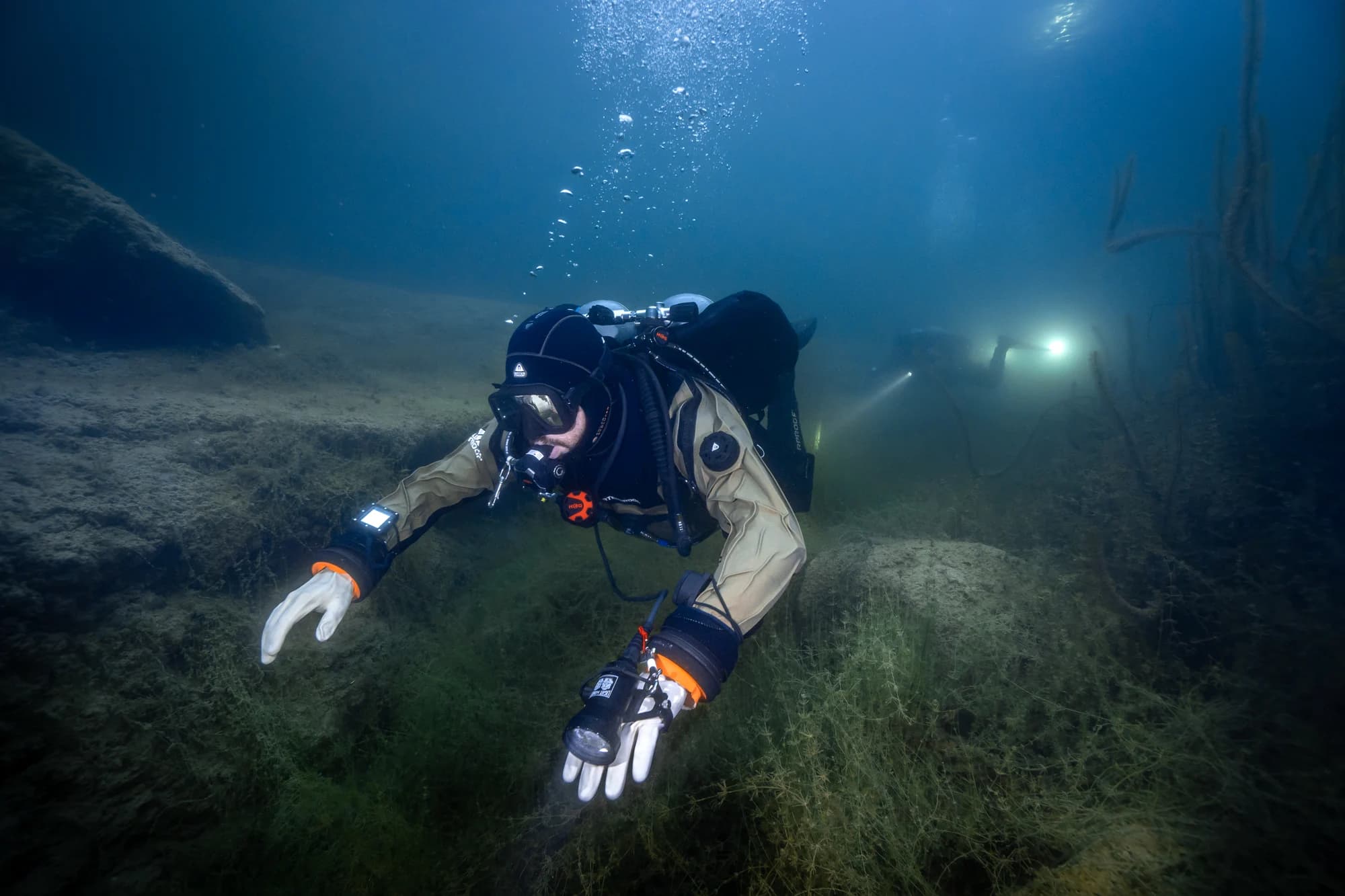 Divers moving together underwater during the Frio River expedition